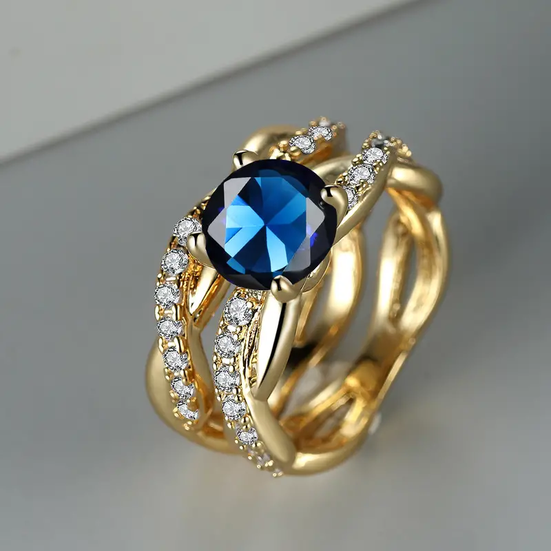Anello d'oro vintage a strati con zirconi blu