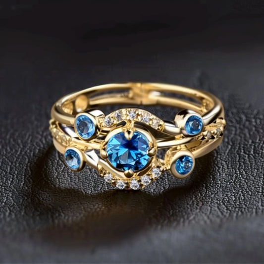 Anello in oro con strato di zirconi blu