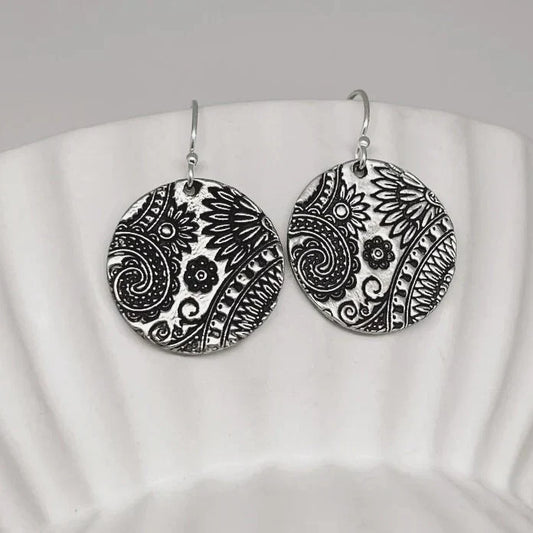 Orecchini vintage con mandala tondo argentato